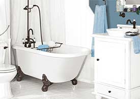 Acrylic clawfoot leg tub in small white bathroom with blue accents