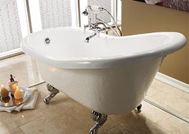 Cast iron clawfoot leg slipper tub in bathroom with beige scheme