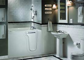 Walk-in bathtub in elegant gray-themed bathroom