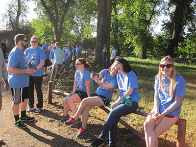 PlumbingSupply.com employees enjoying a rest at the finish line