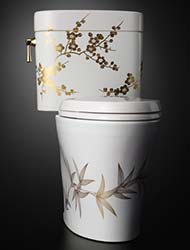 Specialty bamboo and plum painted toilet